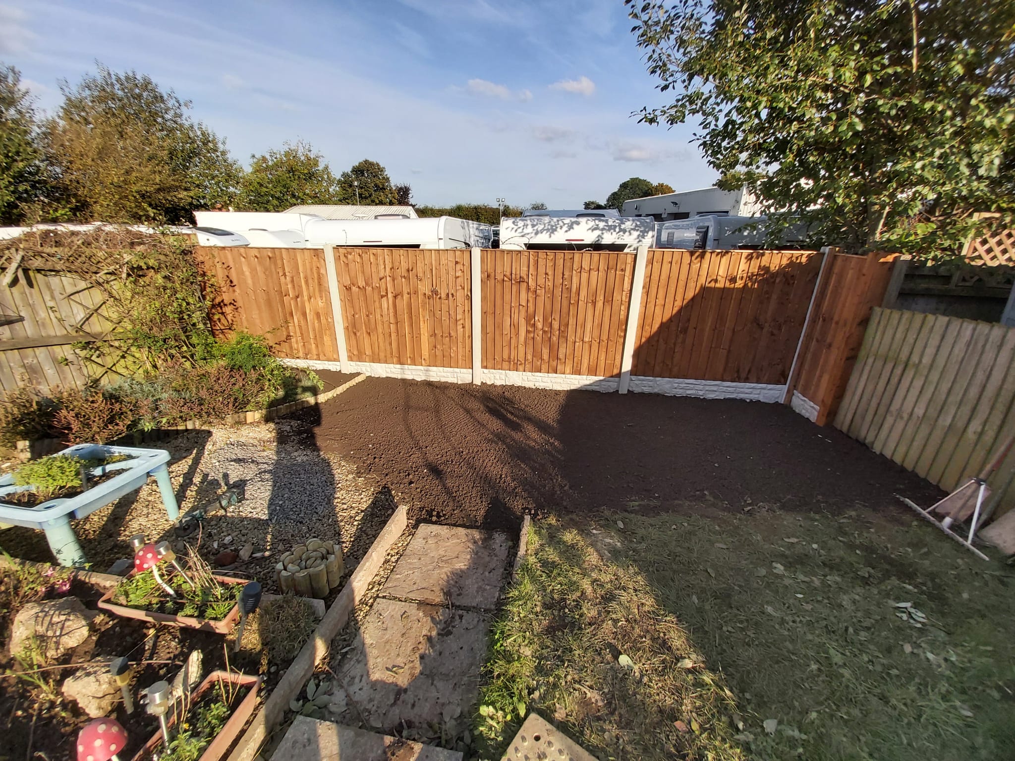 Boundary fencing after replacement, cleanly finished and level